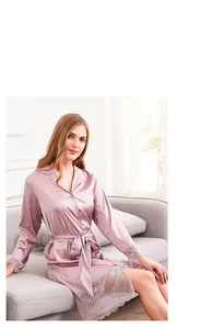 Close-up of elegant mauve silk robe with intricate white lace detailing on sleeves