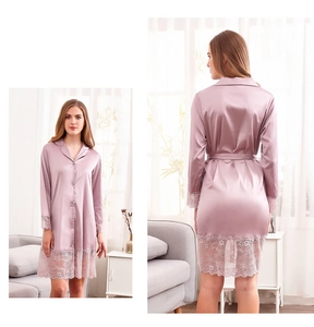 Detail of ice silk robe featuring intricate lace patchwork on sleeves and hemline