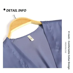 Detail of the V-neckline and M size label on this blue satin nightwear piece
