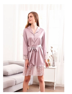 Close-up of pink satin bathrobe featuring elegant eyelash lace trim on sleeves and hem