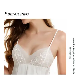 Detail view of white V-neck lace embroidery and mesh fabric on a sexy satin nightgown