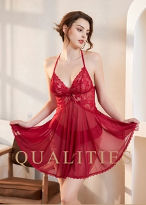 Close-up of red lace embroidery and sheer mesh on a sexy V-neck chemise nightgown