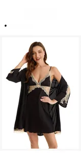 Detail of black satin nightgown with champagne lace trim and matching silk robe sleeves