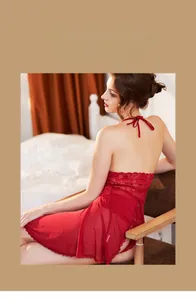 Detail view of red lace nightdress featuring sheer mesh fabric and backless halter neck