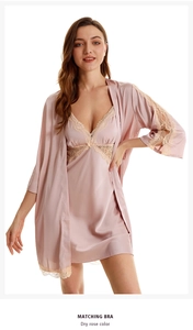 Silk satin robe set with lace trim in dry rose color shown on a model against white background