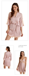 Detail of light pink satin pajama set with delicate lace trim and v-neck design