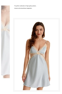 Close-up of light blue satin sleepwear with delicate pink lace trim on V-neckline