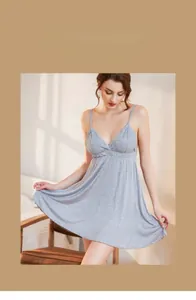 Detailed view of light gray modal nightdress with delicate lace trim on the V-neckline