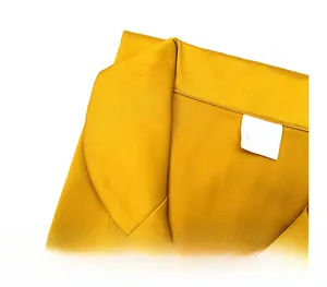 Detail view of the V-neckline and white size label on yellow ice silk lace bathrobe