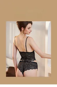 Detailed close-up of semi-transparent black floral lace lingerie set with spaghetti straps