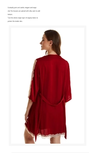 Detailed back view of dark red satin robe with delicate cream lace trim and waist tie