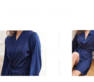 Detail of navy blue silk satin robe showing the smooth texture and tie waist belt