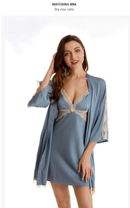 Detail of grey-blue satin nightgown and robe set with delicate beige lace trim