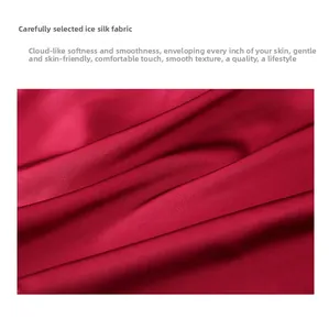 Detail of red ice silk satin fabric texture showing smooth glossy finish and soft folds