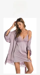 Detail of lilac purple satin nightgown with elegant V-neck and delicate lace embroidery