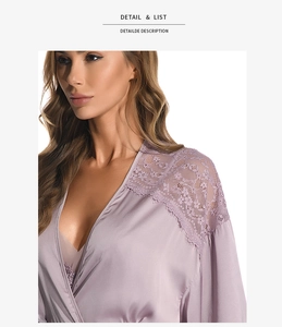 Detailed view of lavender silk robe with intricate lace floral patterns on the shoulder