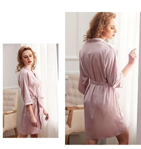 Detail of mauve ice silk bathrobe showing smooth satin texture and elegant waist tie design
