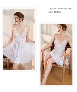 Detail of white lace lingerie nightdress with delicate floral embroidery and sheer mesh