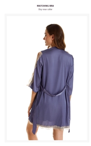 Detail of satin robe featuring delicate beige lace trim on cuffs and hem for a feminine look