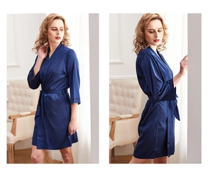 Detail of dark blue silk satin bathrobe with elegant waist tie and V-neckline design