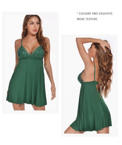 Detail of dark green lace trim stitching and adjustable straps on modal nightgown