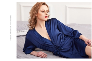 Detail of navy blue silk satin bathrobe showing elegant V-neckline and waist tie belt