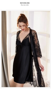 Detail of black satin slip dress and sheer floral lace robe with eyelash trim
