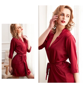 Detail of burgundy ice silk robe with V-neckline and matching belt for a smooth texture