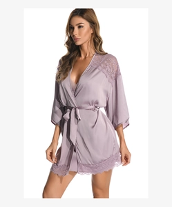 Detail of light purple satin robe with translucent lace patchwork and waist tie belt
