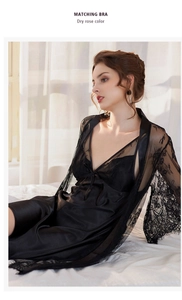 Close-up of black silk satin nightgown with elegant eyelash lace trim and embroidery detail