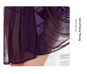 Macro view of purple mesh sleepwear featuring lace trim and a large satin bow detail