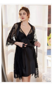 Detail of black silk satin slip dress and sheer floral lace robe with a waist tie