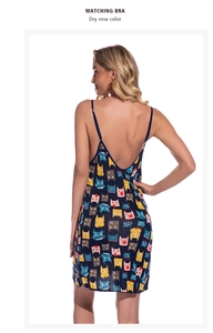 Detail of cross-back strap design on navy modal nightgown with colorful cat print