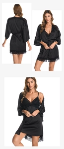 Detailed view of black satin robe set featuring intricate lace edges and silk-like texture