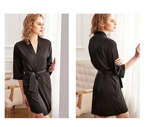 Close-up of black silk satin robe with V-neckline and adjustable matching waist tie
