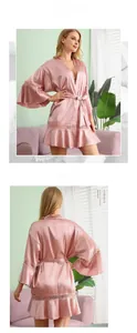Detailed view of pink silk bridal robe with exquisite lace cuffs and hem stitching