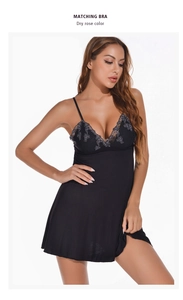 Detailed view of the intricate gray floral lace embroidery on the black V-neck nightgown
