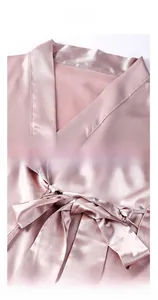 Detail of V-neckline and matching waist tie on mauve silk satin bathrobe for women