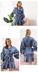 Detail view of navy blue satin bridal robe with delicate lace trims and waist belt
