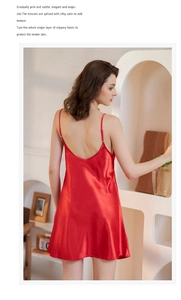 Detailed back view of red silk satin slip dress showing elegant drape and strap design