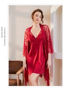 Detail of red satin slip dress and floral lace cardigan set with bow accent