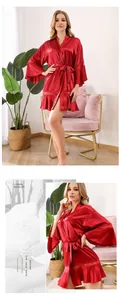 Elegant red silk satin bridal robe featuring delicate lace trim on cuffs and hem
