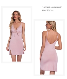 Close-up of pink lace slip nightgown featuring deep V-neck and delicate bow detail