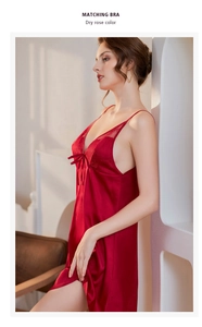 Close-up of dry rose silk nightgown with delicate lace embroidery and bow detail