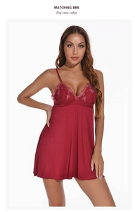 Detail of dry rose modal nightgown featuring delicate red lace embroidery and deep V-neck