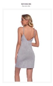 Detail of the deep V-back design and soft jersey cotton texture on a grey camisole dress