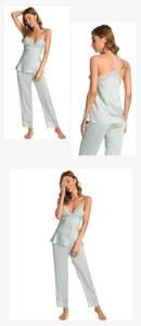 Detailed view of light green silk pajama set with delicate lace trim on hem and neckline