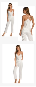 Detail of white silk pajama set with lace trim and adjustable straps for women