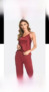 Close-up of wine red silk pajama set with delicate lace trim on V-neck camisole top