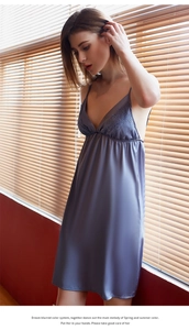 Detailed view of dusty blue satin nightgown with elegant lace trim and V-neckline